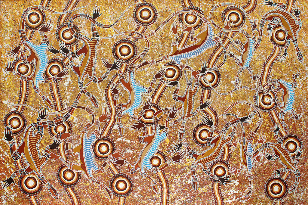 Artwork by Uncle Richard Campbell, spiritual image of goannas on the front of a rock.