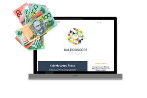 laptop with kaleidoscope focus website next to money