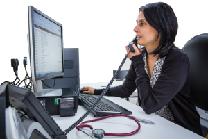 person at a desk on the phone