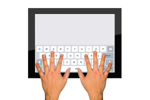 hands on a computer keyboard