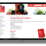 laptop with screenshot of the NSW fire and rescue website with translated fact sheets about fire safety