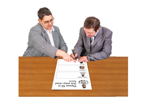 two people at a desk making a plan together