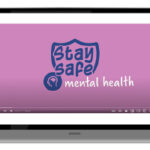 laptop with screen shot of the CID website with a video about mental health safety