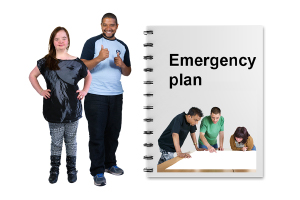 2 people standing next to an emergency plan