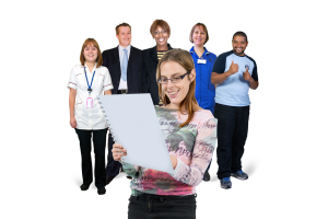 person looking at a page of information with a group of peolpe in the background