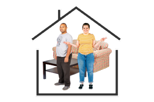 two people standing in a house