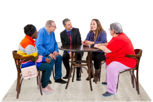 group of people meeting around a table