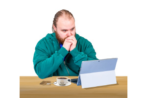 concerned person looking at a laptop