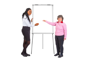 Two people pointing at a blank white board