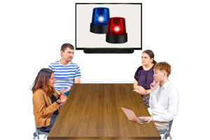 people at table with presentation with sirens