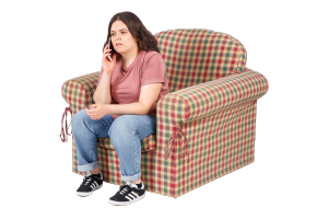 person on the phone in a chair