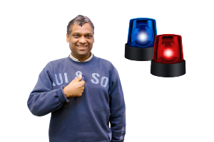 person standing next to emergency flashing lights