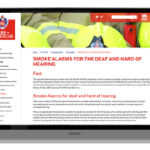 laptop with screenshot of the nsw fire and rescue webpage with information about smoke alarms