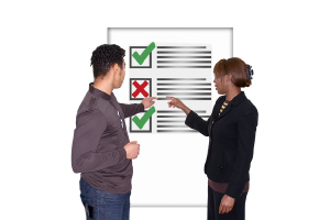 people pointing at a checklist