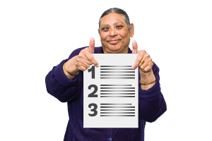 person holding paper with tips numbered 1, 2, 3